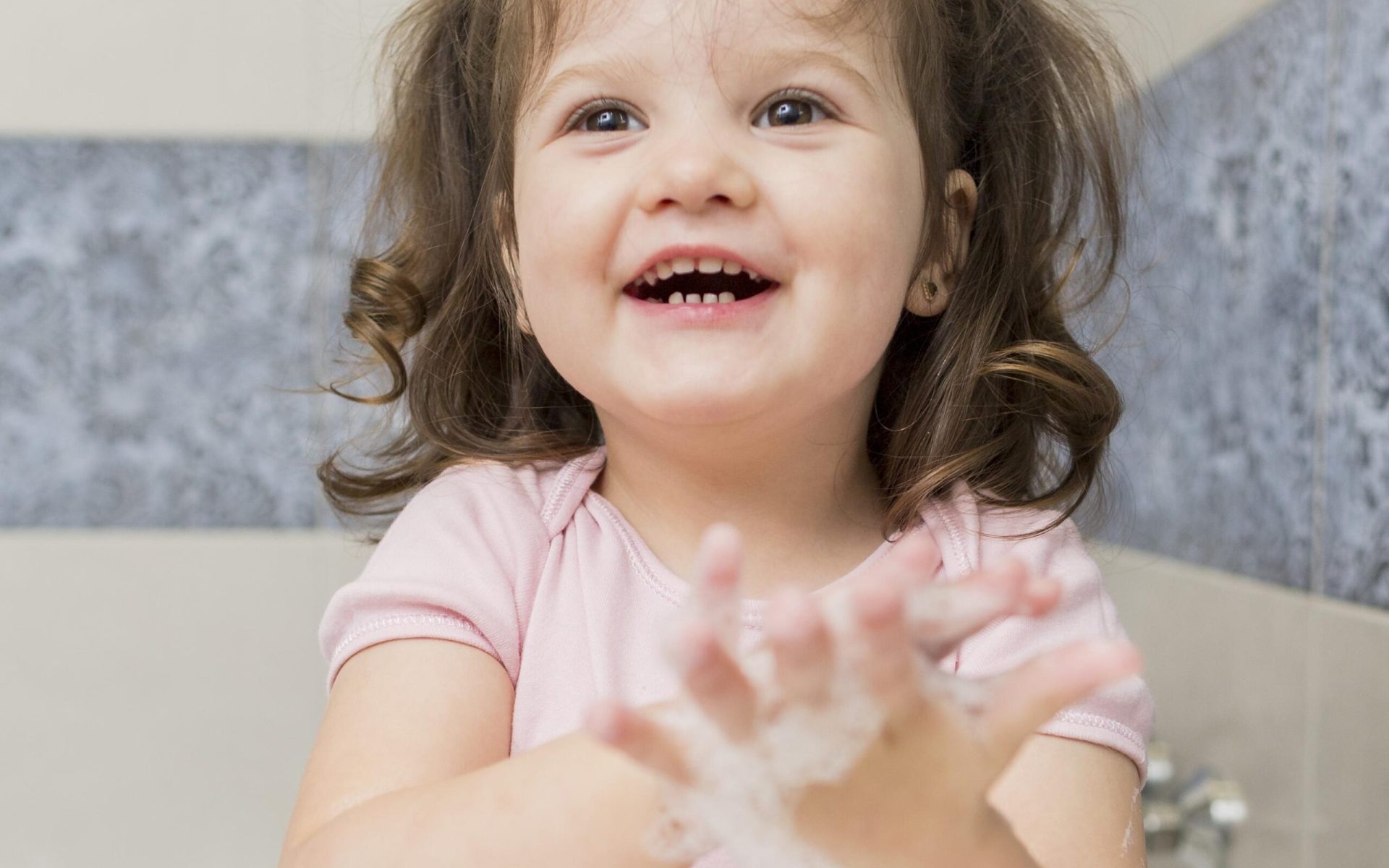 happy-little-girl-washing-hands Sponge bathing a newborn